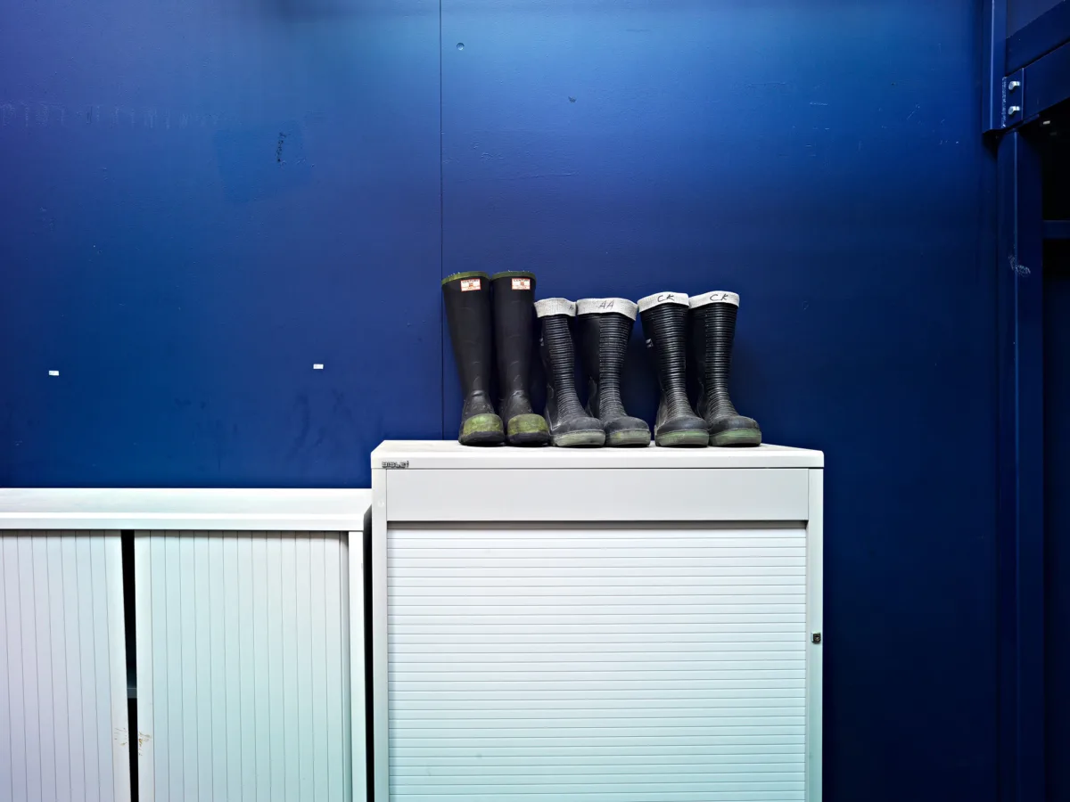 Industrial photography, ABB refinery Burghausen Germany, rubber boots at plant entrance, by Scanderbeg Sauer