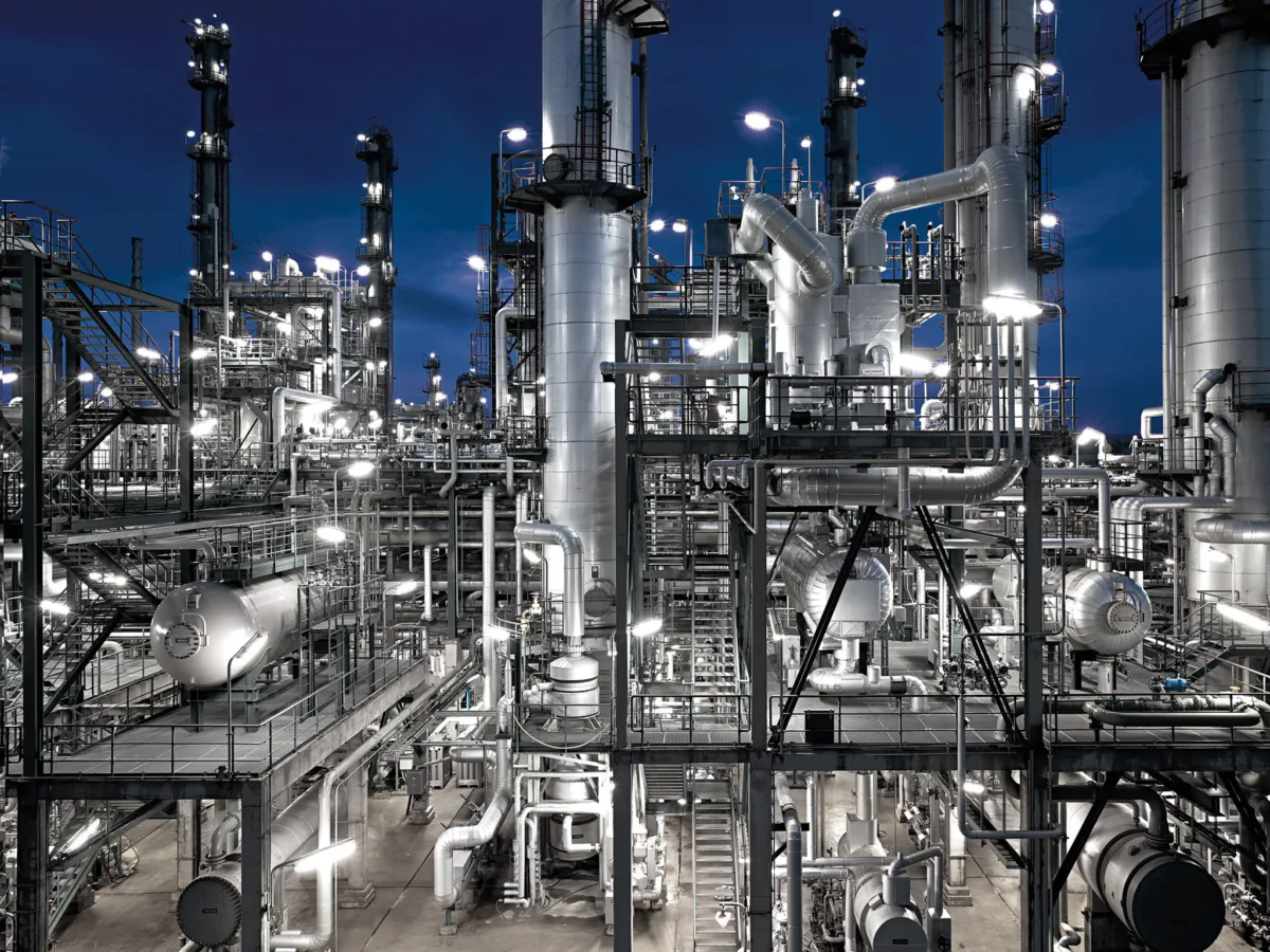 Industrial photography, ABB refinery Burghausen Germany at night, distillation columns and steel structures, by Scanderbeg Sauer