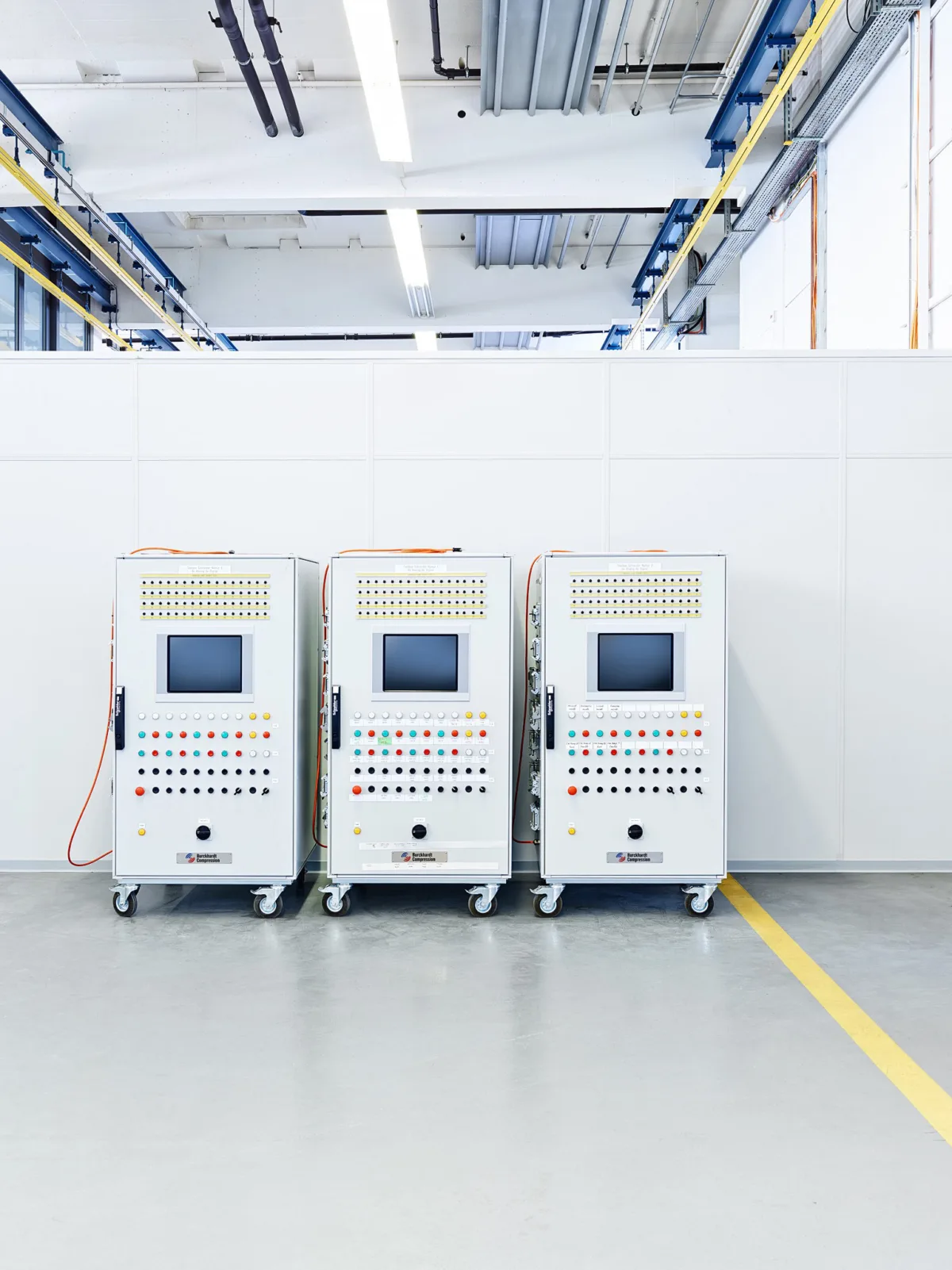 Row of compressor control cabinets in the production hall, Burckhardt Compression, Winterthur, industrial photography by Scanderbeg Sauer