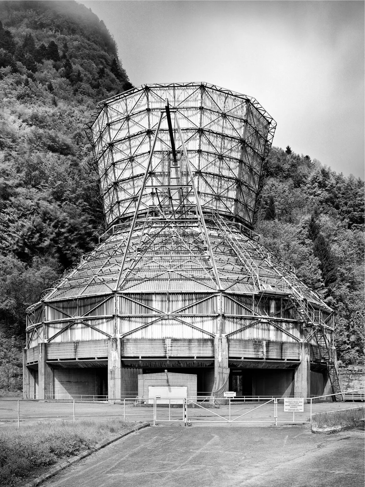 Decommissioned cooling tower structure of the Chavalon thermal power station, photographed by Scanderbeg Sauer