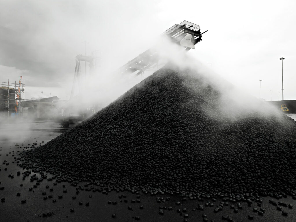Coal stockpile with steam, CPL Industries, Cleethorpes, United Kingdom, industrial photography by Scanderbeg Sauer