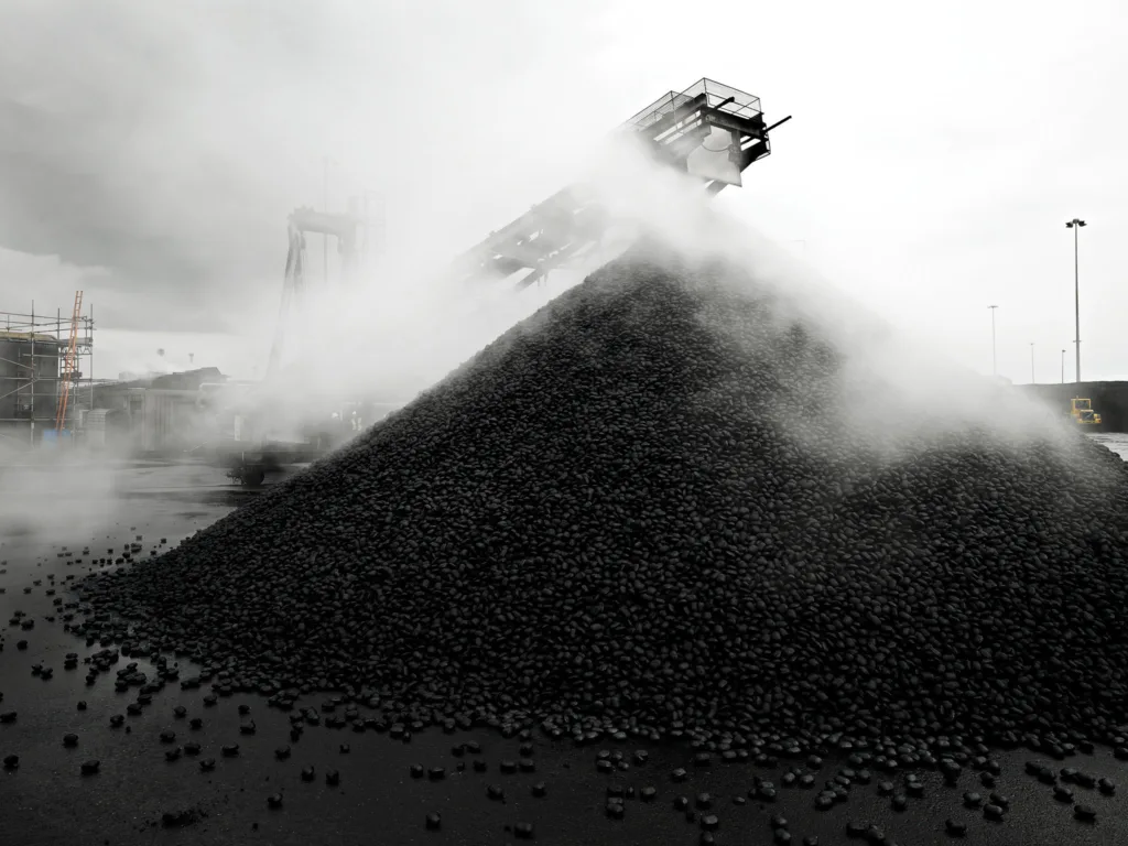 Coal stockpile with steam, CPL Industries, Cleethorpes, United Kingdom, industrial photography by Scanderbeg Sauer