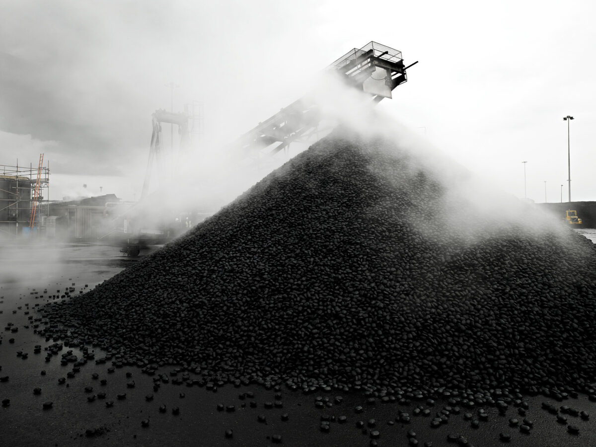 Coal stockpile with steam, CPL Industries, Cleethorpes, United Kingdom, industrial photography by Scanderbeg Sauer