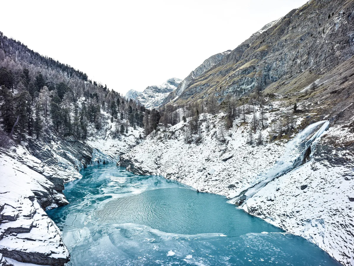 Turquoise glacial lake in a snow-covered valley, Eternal Ice, Zmutt, Switzerland, landscape photography by Scanderbeg Sauer