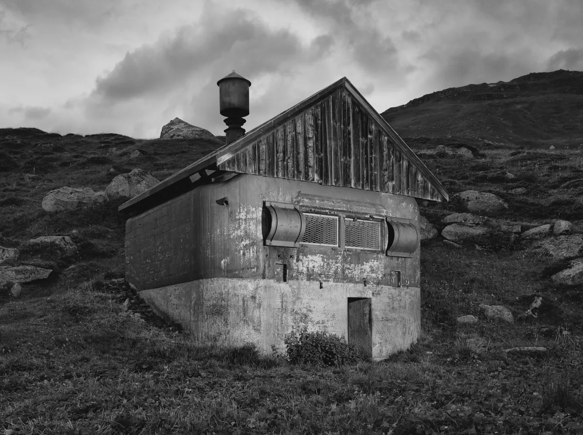 Military bunker disguised as a barn, Furka Pass, Obergoms, Switzerland, architecture photography by Scanderbeg Sauer