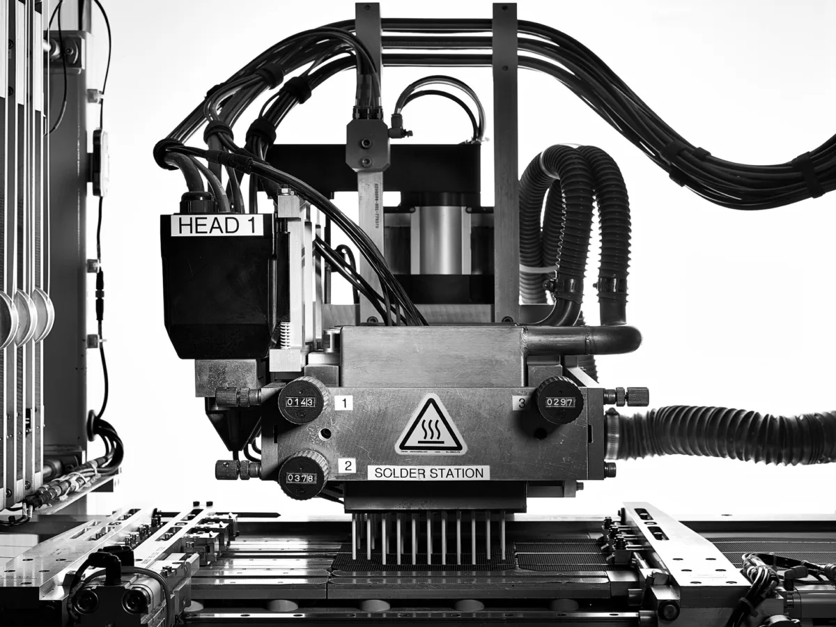 Automated production machine head, Megasol, Langenthal, Switzerland, industrial photography by Scanderbeg Sauer