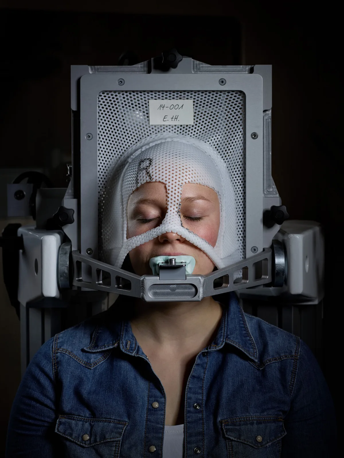 Patient in a thermoplastic mask during proton therapy, Paul Scherrer Institute, Villigen, Switzerland, research photography by Scanderbeg Sauer