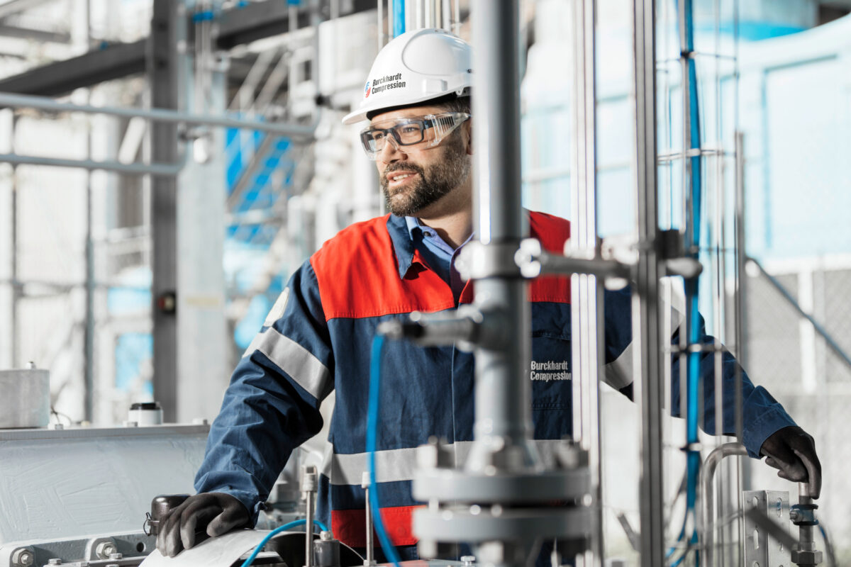 Technician assembling a compressor in the production hall, Burckhardt Compression, Winterthur, industrial photography by Scanderbeg Sauer
