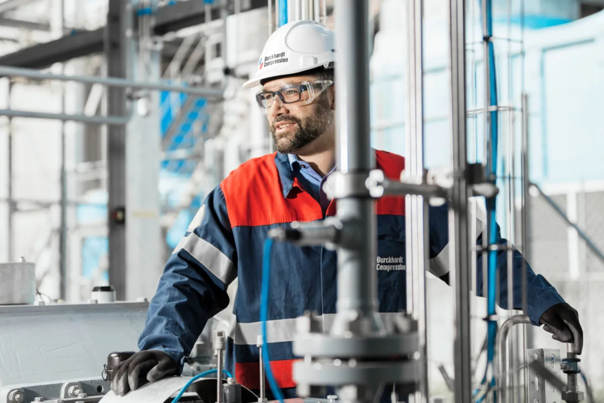 Technician assembling a compressor in the production hall, Burckhardt Compression, Winterthur, industrial photography by Scanderbeg Sauer