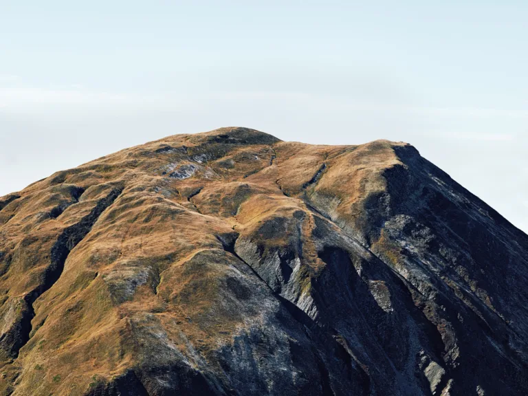 Barren mountain ridge in evening light, Furka Pass, Obergoms, Switzerland, landscape photography by Scanderbeg Sauer