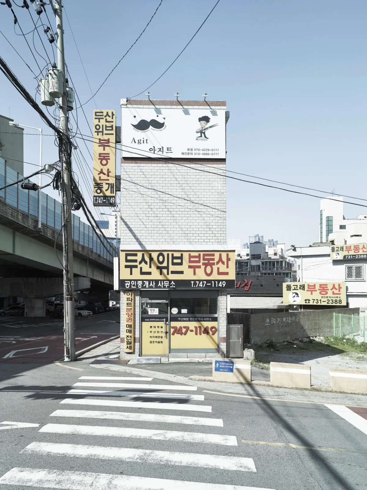 Pedestrian crossing and shopfronts, Busan, South Korea, street photography by Scanderbeg Sauer