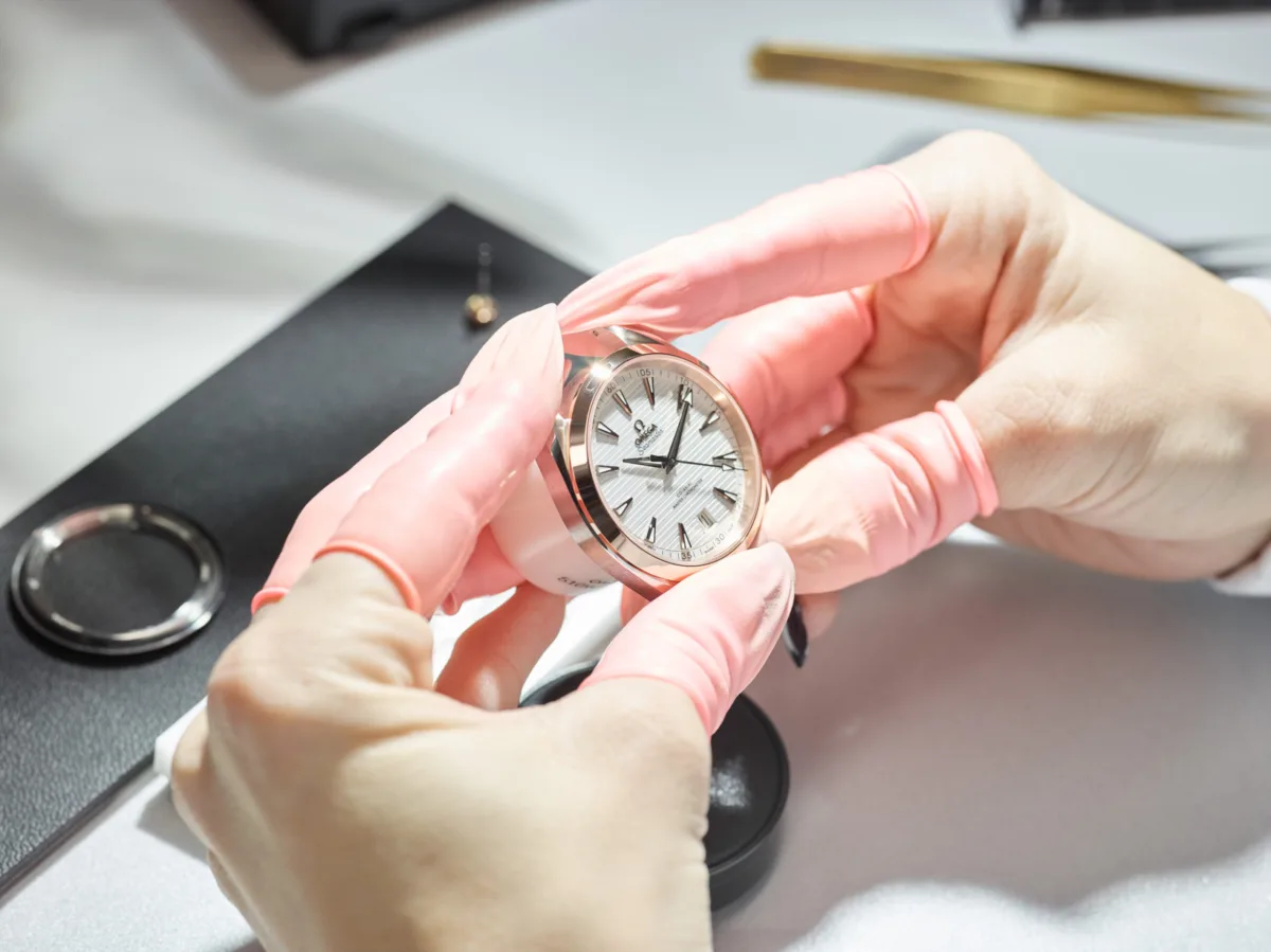 Assembling a watch by hand, Omega, Bienne, Switzerland, watchmaking photography by Scanderbeg Sauer