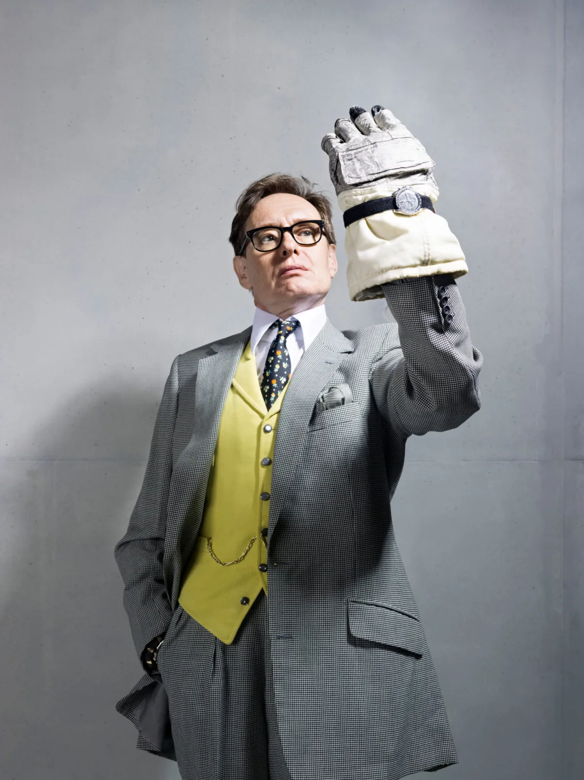 Editorial portrait with Apollo spacesuit glove, Omega, London, UK, portrait photography by Scanderbeg Sauer