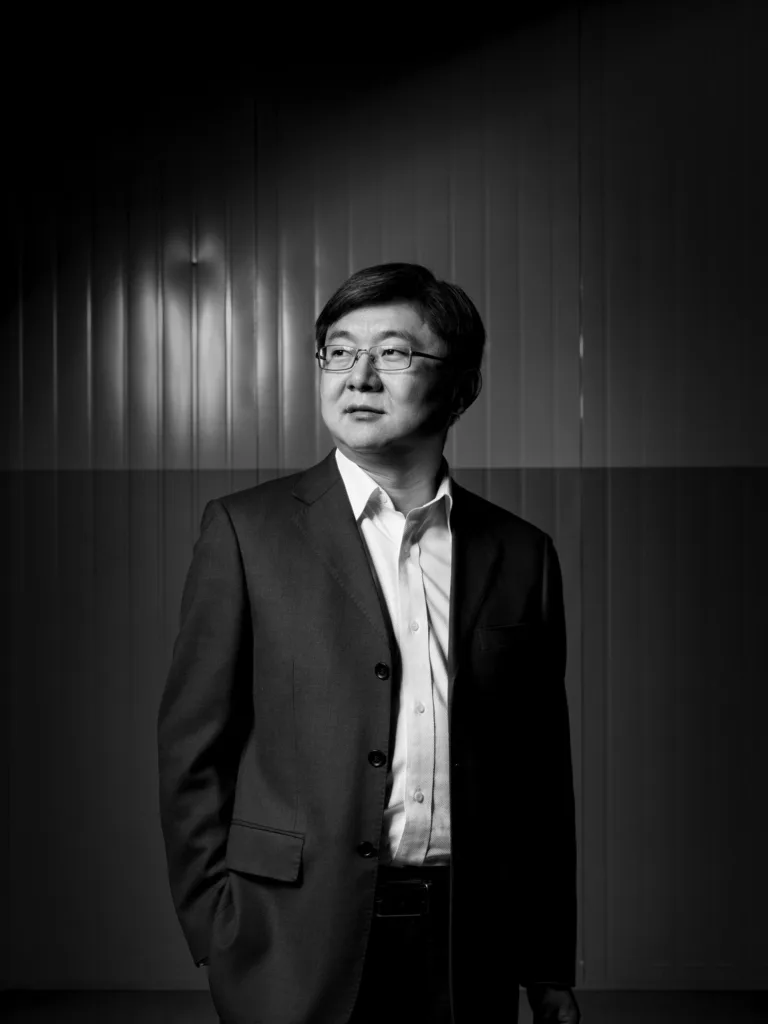 Black-and-white executive portrait of a Burckhardt Compression manager, Ningbo, China, industrial photography by Scanderbeg Sauer