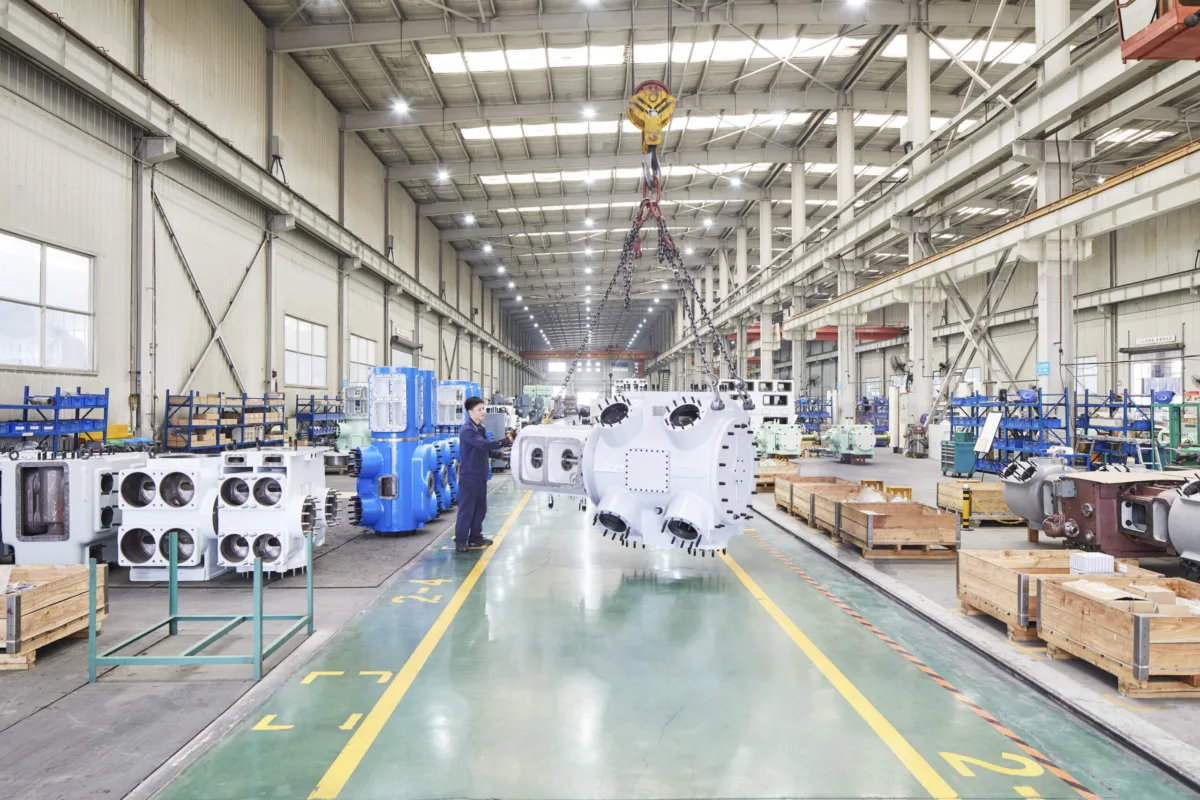 Assembly hall with compressor units in production and overhead crane, Shenyang Yuanda Compressor, Shenyang, China, industrial photography by Scanderbeg Sauer