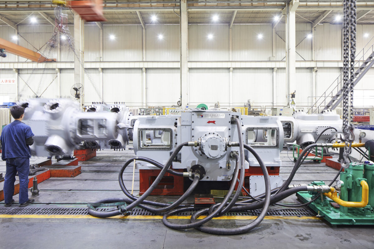 Compressor units in assembly in the production hall, Shenyang Yuanda Compressor, Shenyang, China, industrial photography by Scanderbeg Sauer