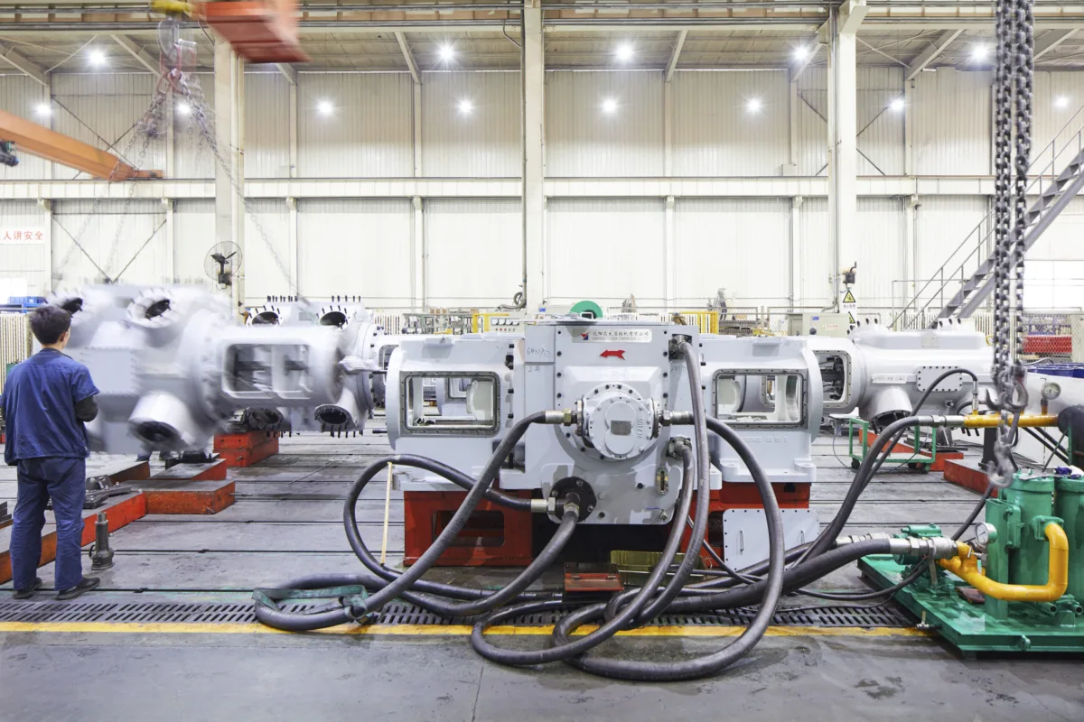 Compressor units in assembly in the production hall, Shenyang Yuanda Compressor, Shenyang, China, industrial photography by Scanderbeg Sauer