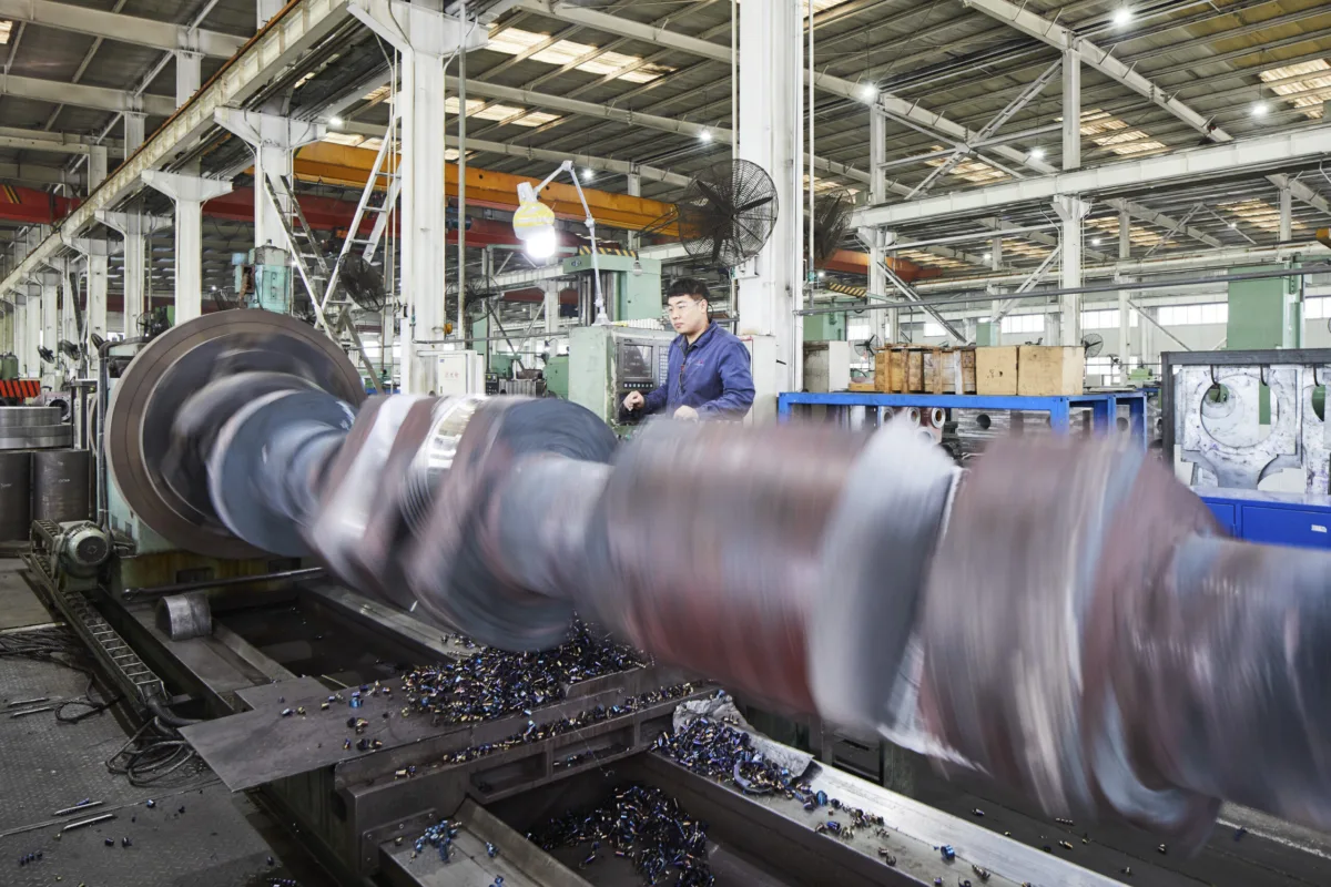 Large compressor crankshaft being machined on a lathe, Shenyang Yuanda Compressor, Shenyang, China, industrial photography by Scanderbeg Sauer