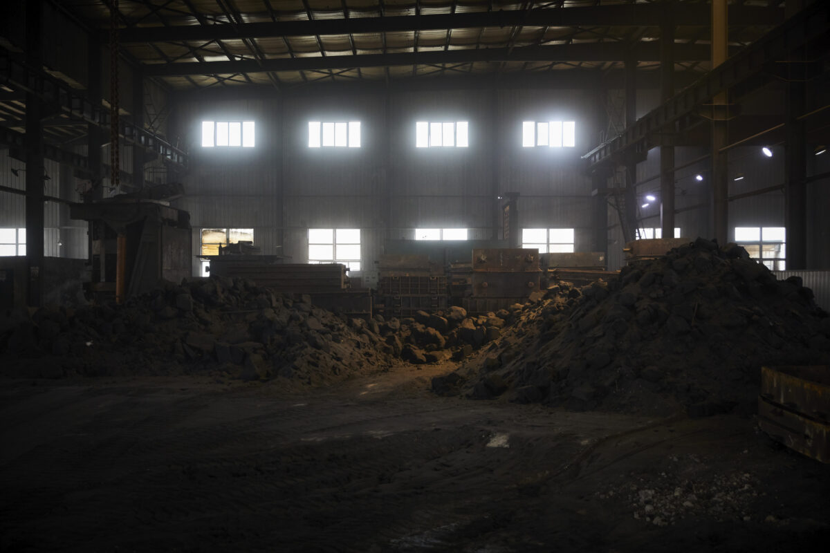 Foundry hall interior with moulding sand, Shenyang Yuanda Foundry, Shenyang, China, industrial photography by Scanderbeg Sauer