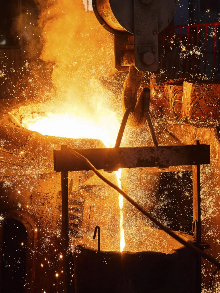 Molten metal pouring during iron casting in the foundry, Shenyang Yuanda Foundry, Shenyang, China, industrial photography by Scanderbeg Sauer