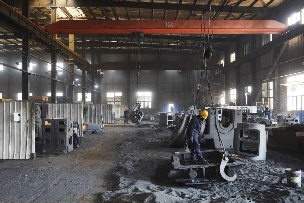 Foundry production floor with overhead crane, Shenyang Yuanda Foundry, Shenyang, China, industrial photography by Scanderbeg Sauer
