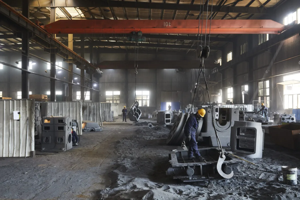 Foundry production floor with overhead crane, Shenyang Yuanda Foundry, Shenyang, China, industrial photography by Scanderbeg Sauer