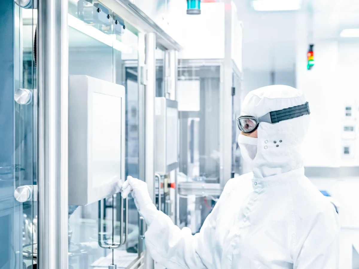 Technician operating cleanroom equipment, Datwyler, Alken, Belgium, industrial photography by Scanderbeg Sauer