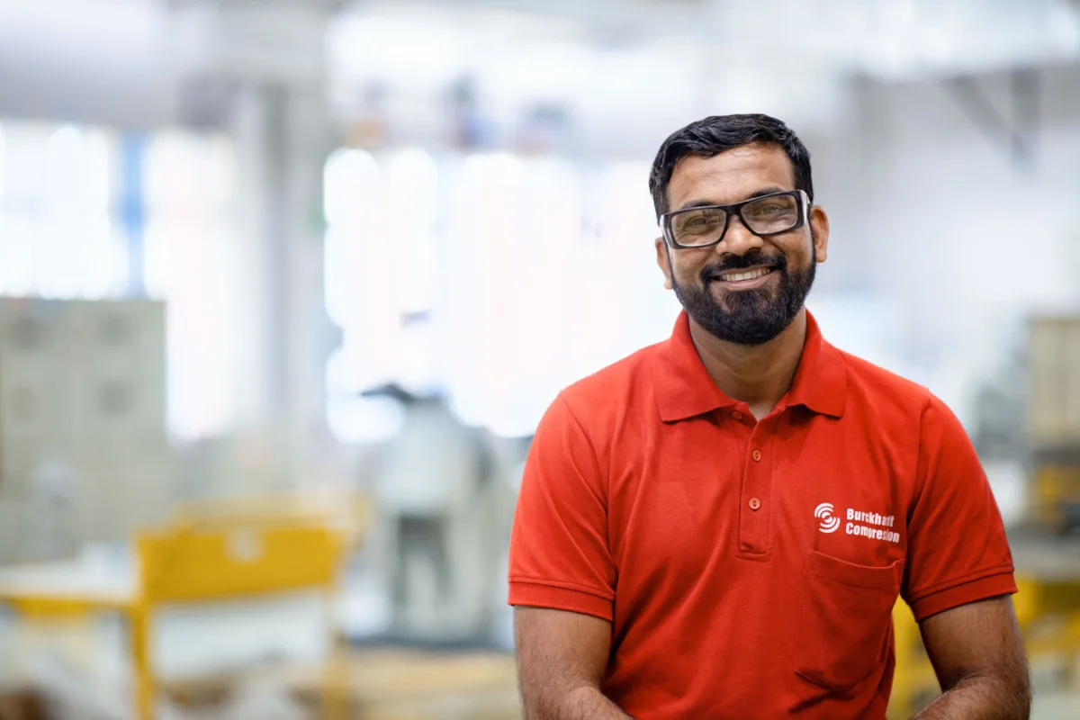 Employee portrait in the production hall, Burckhardt Compression, Pune, India, industrial photography by Scanderbeg Sauer