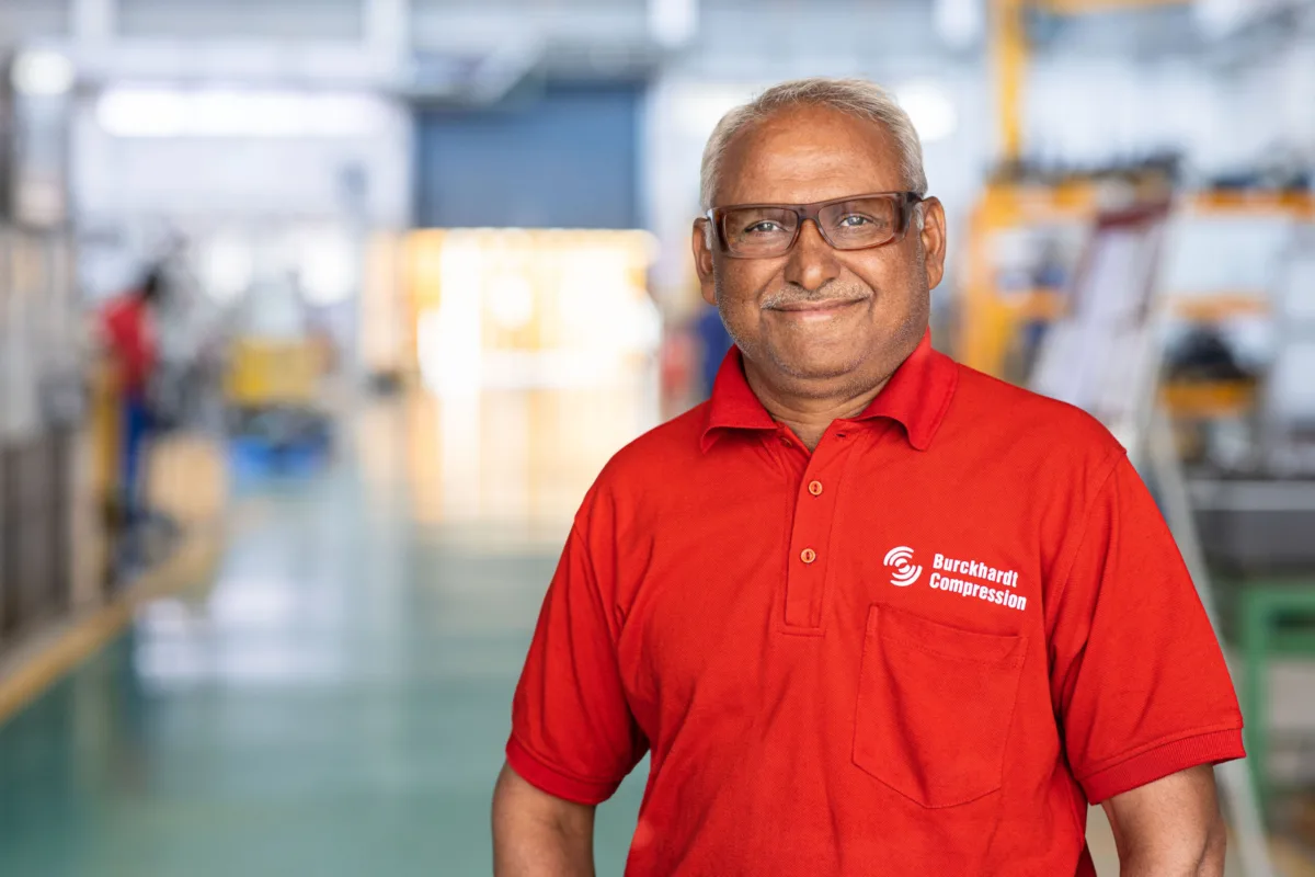 Employee portrait in the production hall, Burckhardt Compression, Pune, India, industrial photography by Scanderbeg Sauer