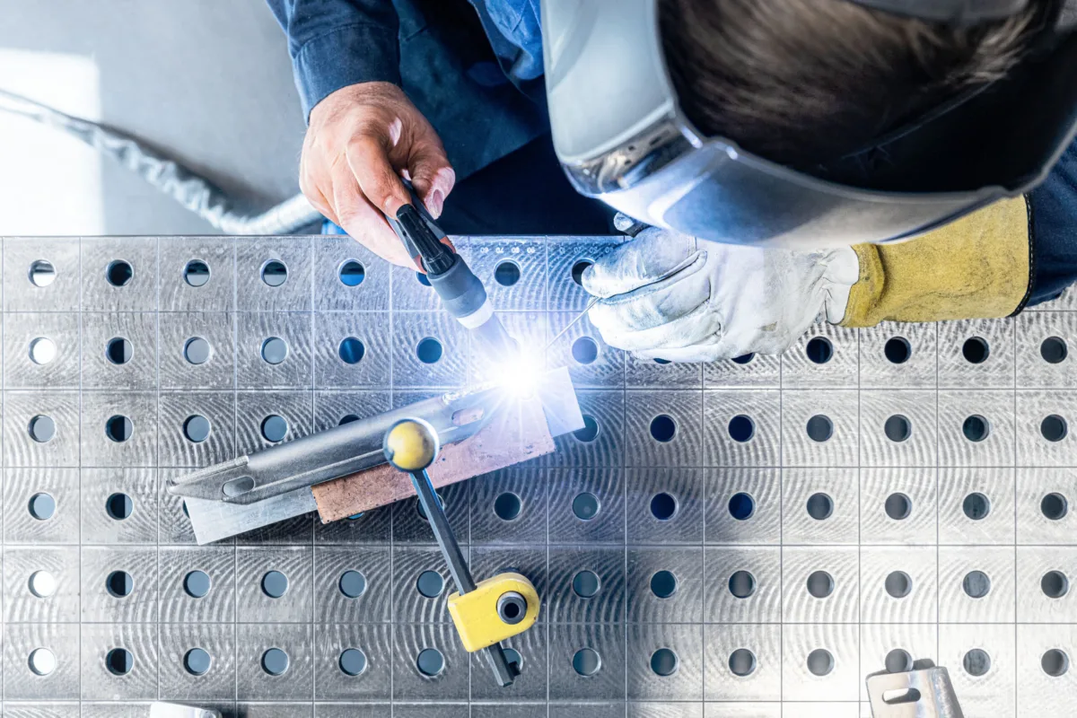 Welding work on a jig table at eMDe Blechfabrik, Swissmem, Association of MEM Industries, Switzerland, industrial photography by Scanderbeg Sauer