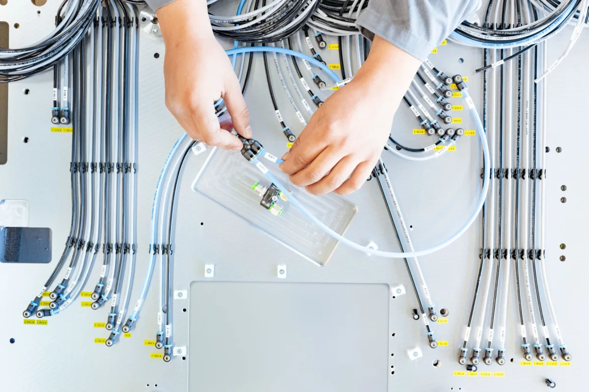 Machine wiring assembly at Precitrame Machines, Swissmem, Association of MEM Industries, Switzerland, industrial photography by Scanderbeg Sauer