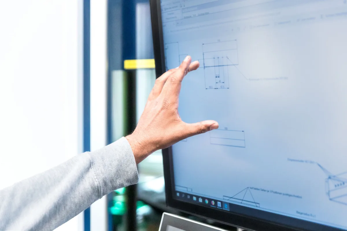 Hand interacting with a touchscreen interface, Swissmem, Association of MEM Industries, Switzerland, corporate photography by Scanderbeg Sauer