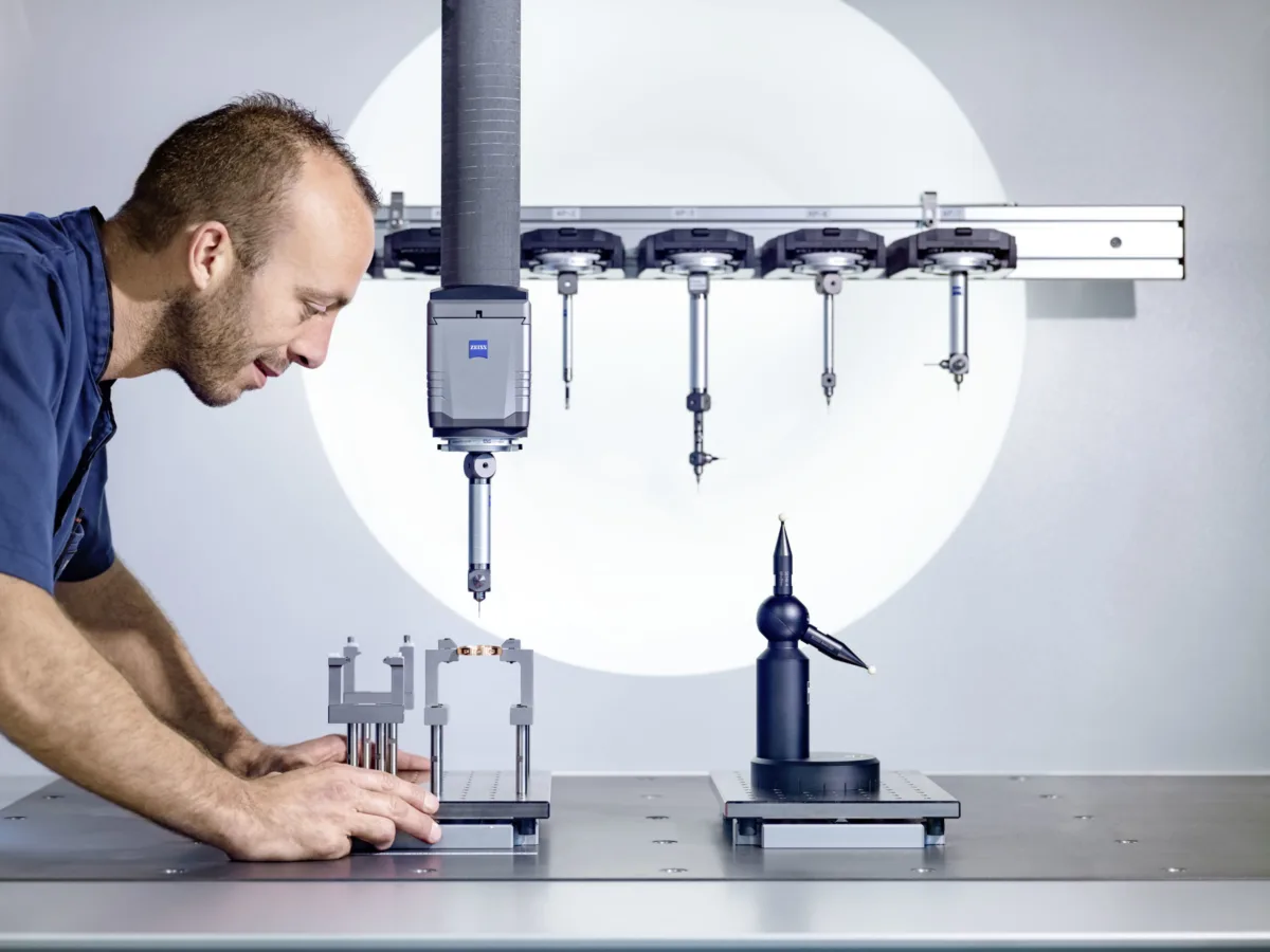 Watchmaking photography, Audemars Piguet watchmaker inspecting Code 11.59 case component, Le Brassus, by Scanderbeg Sauer