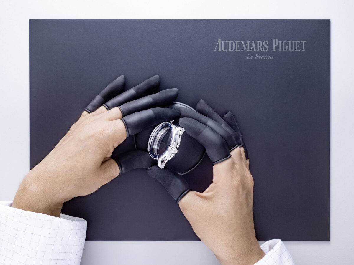 Watchmaking photography, Audemars Piguet Code 11.59 watch held in gloved hands, Le Brassus, by Scanderbeg Sauer