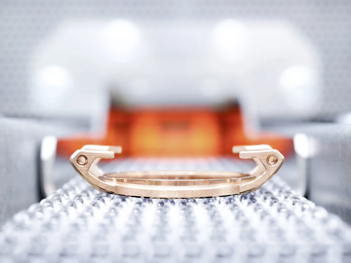 Watchmaking photography, Audemars Piguet Code 11.59 case on precision tooling fixture, multifaceted curved geometry, Le Brassus, by Scanderbeg Sauer