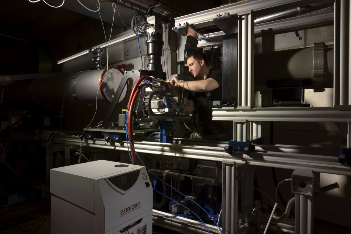 Scientific photography, researcher at beamline instrument, ANAXAM Villigen, by Scanderbeg Sauer