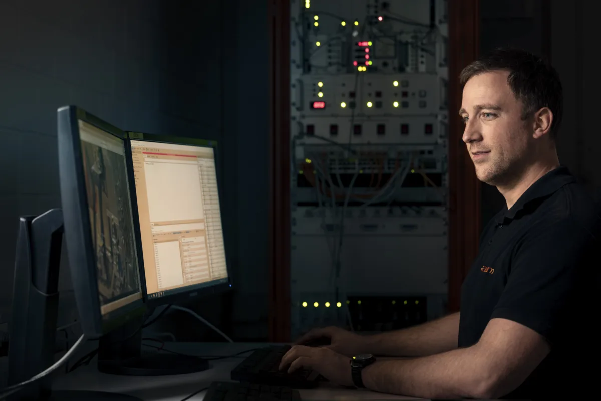 Scientific photography, researcher portrait at control station, ANAXAM Villigen, by Scanderbeg Sauer