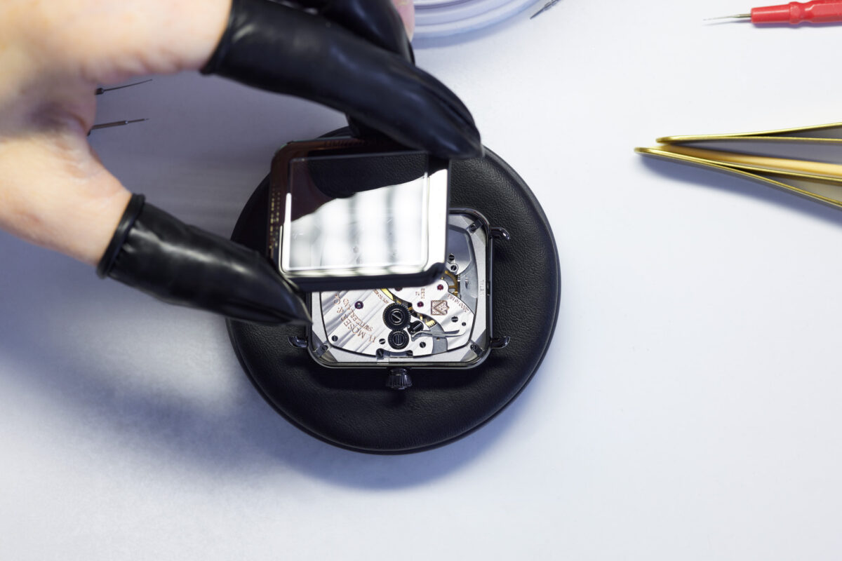 Watchmaking photography, H. Moser & Cie. Swiss Alp Watch caseback assembly, Schaffhausen, by Scanderbeg Sauer
