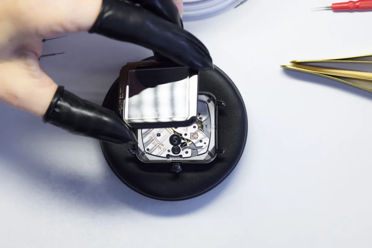 Watchmaking photography, H. Moser & Cie. Swiss Alp Watch caseback assembly, Schaffhausen, by Scanderbeg Sauer