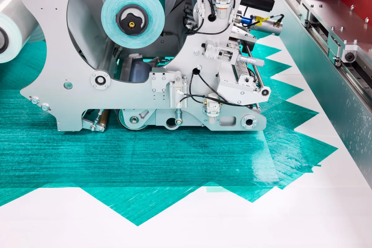 Automated tape layup of TPT composite material, Richard Mille, Lausanne, Switzerland, industrial photography by Scanderbeg Sauer